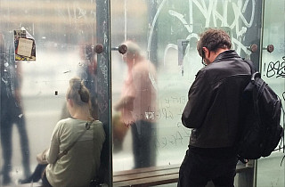 Julien Tatham working in photography with a mobile phone for "Us Stop"