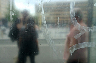 Julien Tatham working in photography with a mobile phone for "Us Stop"